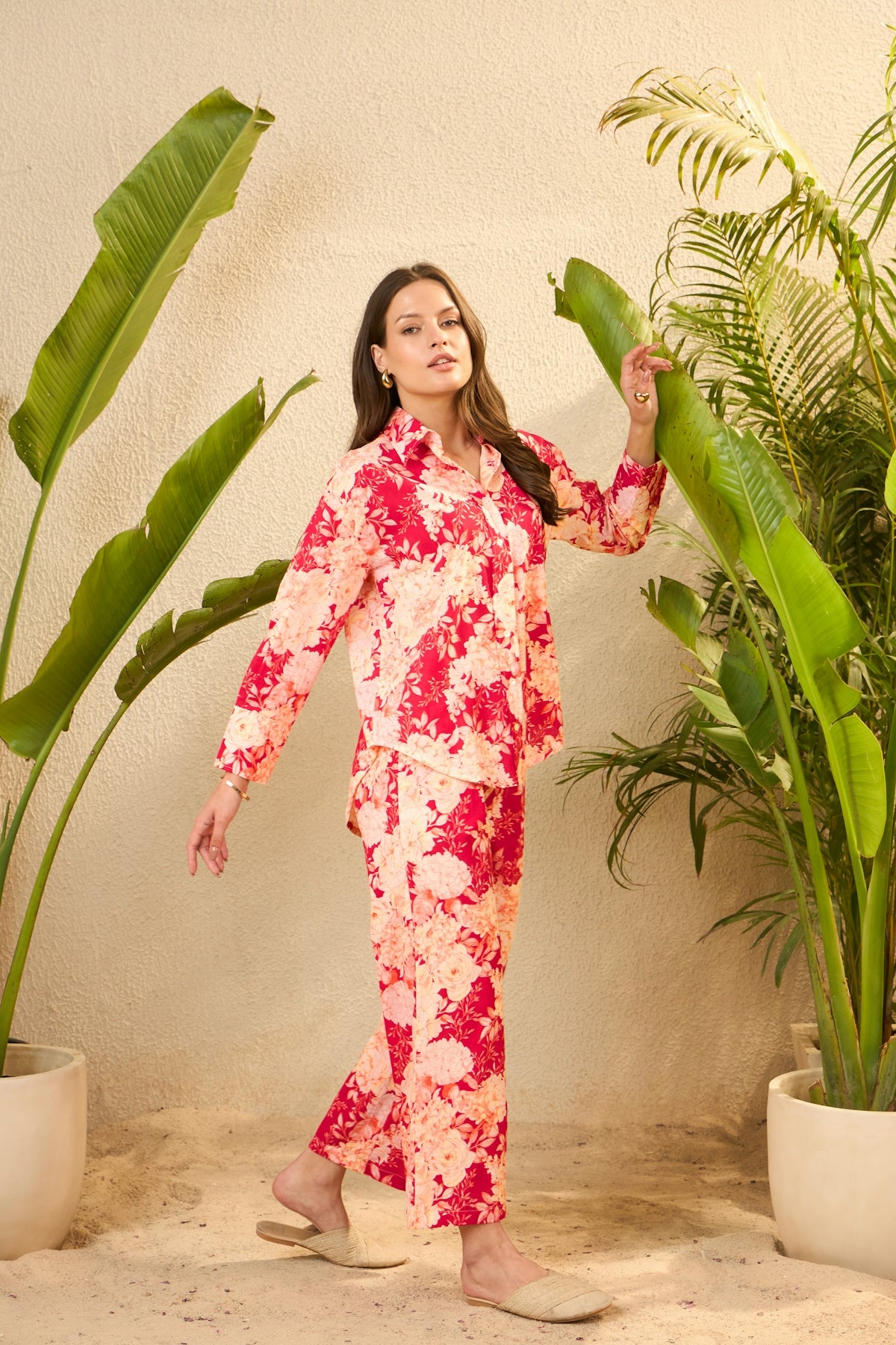 Woman in a pink and red tie-dye pajama set.