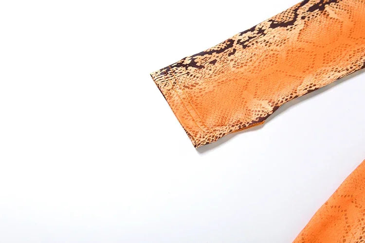 Canarsie Hollow Serpentine Print O Neck Full Sleeve Skinny Peach Hip Jumpsuit
