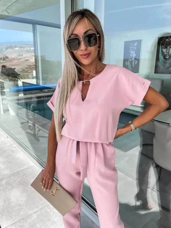 Xiomara Sleeved V-Neck Slip Pocket Elastic Jumpsuits - Vestir en Moda