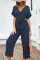 Elliana Solid Belted Tie Waist Surplice Wide Leg Jumpsuit - Vestir en Moda